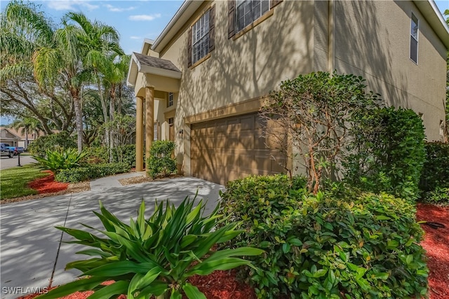 view of side of home featuring a garage