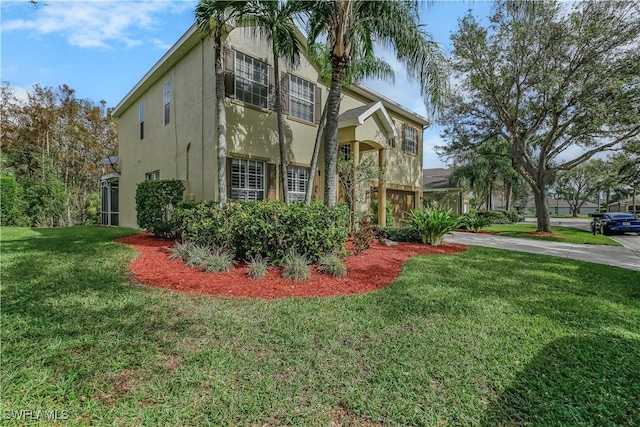 view of side of property featuring a yard