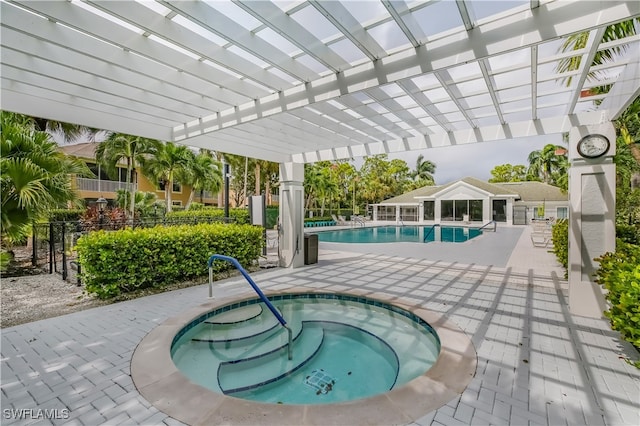 view of pool with a patio area, a community hot tub, and a pergola