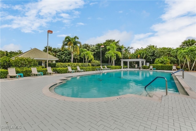 view of swimming pool with a patio area