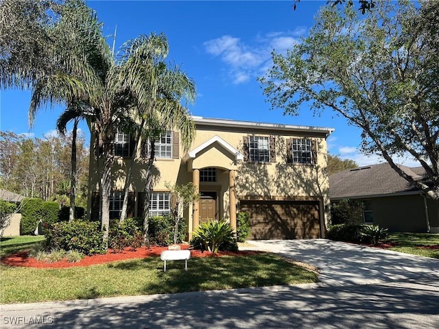 22890 Forest Ridge Dr, Estero, FL 33928 - traditional-style house with a garage, stucco siding, and concrete driveway