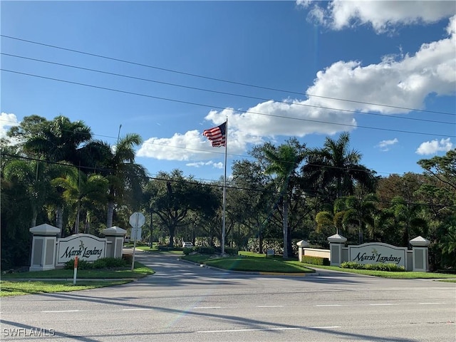 22890 Forest Ridge Dr, Estero, FL 33928 - view of asphalt road with traffic signs