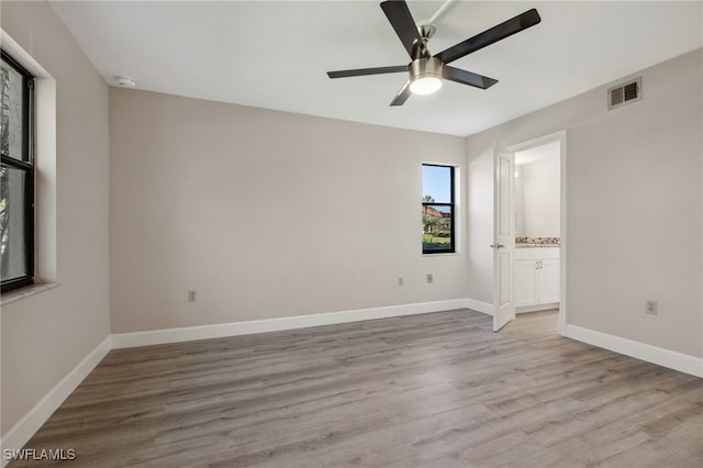 empty room featuring light hardwood / wood-style flooring and ceiling fan