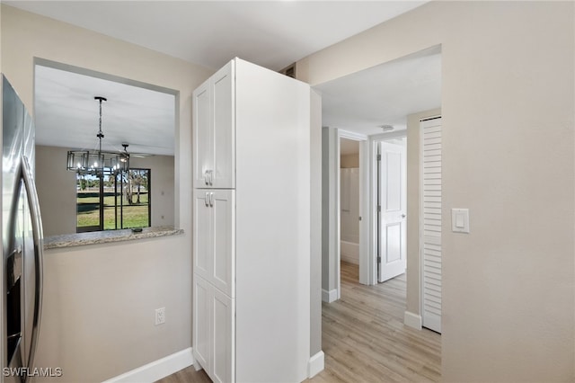 hallway featuring light hardwood / wood-style flooring