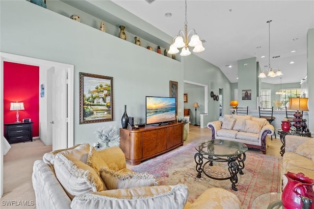 carpeted living room with high vaulted ceiling, recessed lighting, and an inviting chandelier