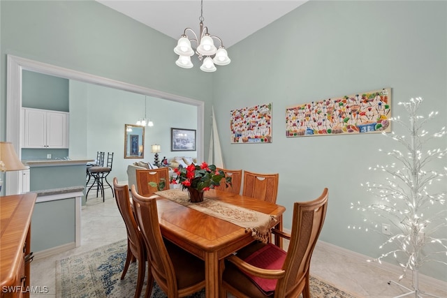 tiled dining area featuring vaulted ceiling and an inviting chandelier