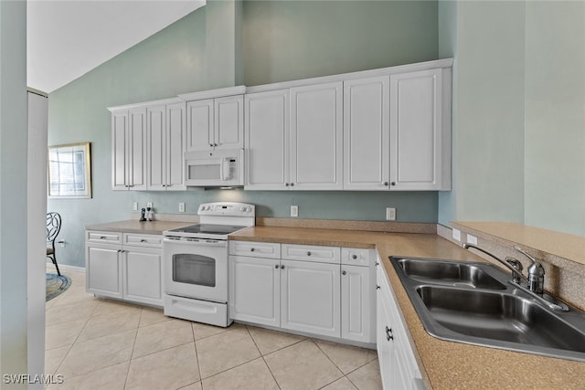 kitchen with sink, white cabinets, white appliances, and high vaulted ceiling