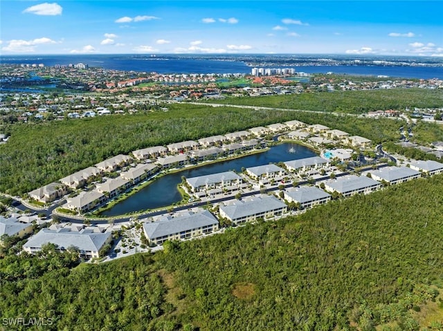 birds eye view of property with a water view and a residential view