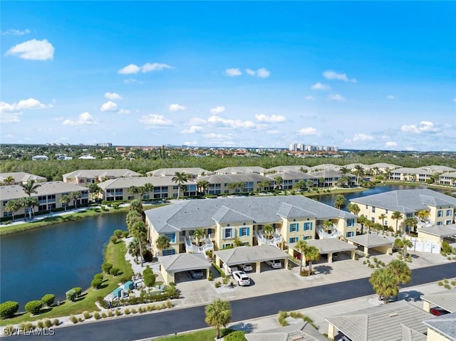 birds eye view of property with a water view and a residential view
