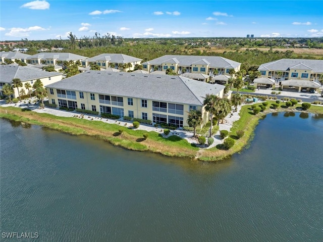 bird's eye view featuring a residential view and a water view