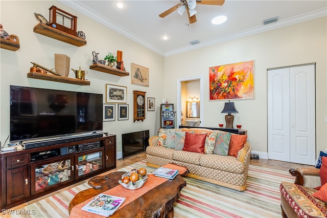 living room featuring ceiling fan and ornamental molding