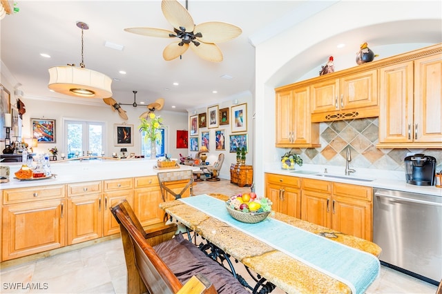 kitchen with ceiling fan, sink, hanging light fixtures, tasteful backsplash, and stainless steel dishwasher