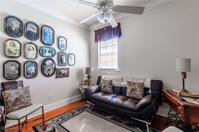 living room featuring ceiling fan, ornamental molding, and hardwood / wood-style flooring