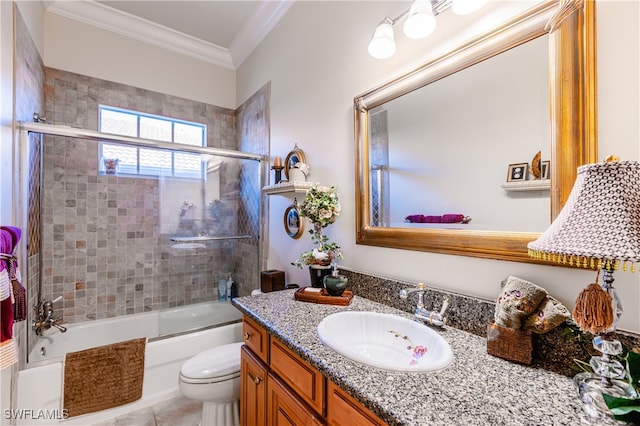 full bathroom with vanity, tile patterned floors, combined bath / shower with glass door, crown molding, and toilet