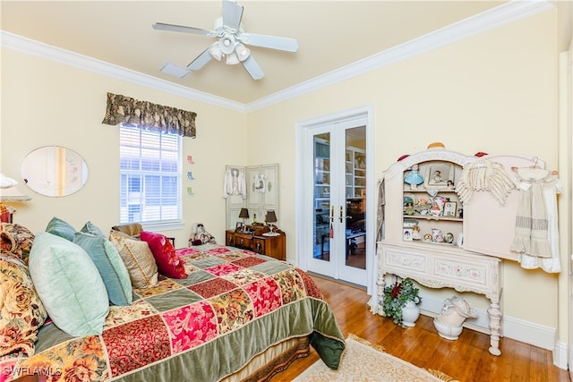 bedroom with ceiling fan, wood-type flooring, ornamental molding, and french doors