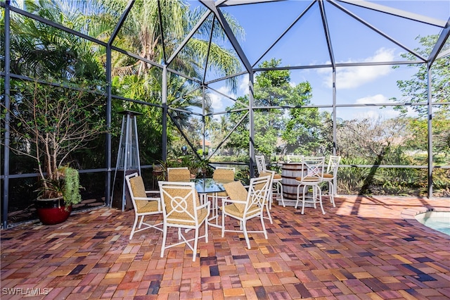 view of patio with glass enclosure