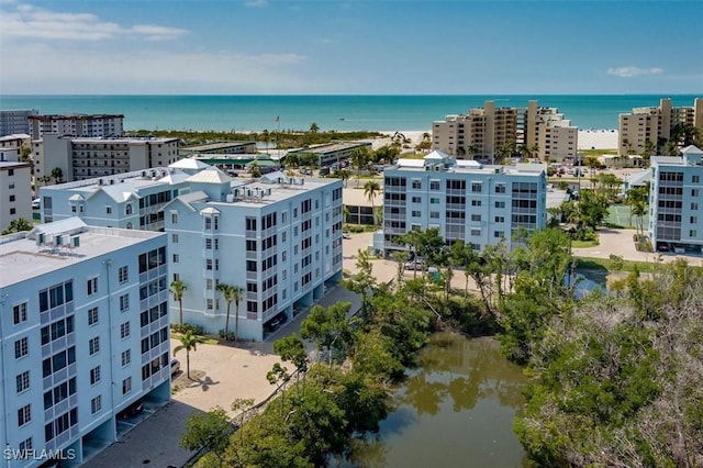 drone / aerial view featuring a water view and a city view