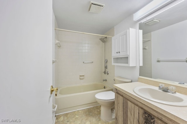 full bathroom with vanity, tiled shower / bath, and toilet