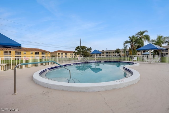 view of swimming pool with a patio area