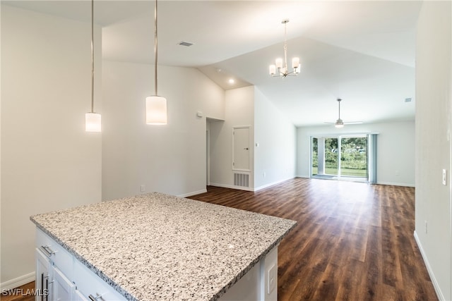 kitchen featuring white cabinets, ceiling fan with notable chandelier, dark hardwood / wood-style floors, and pendant lighting