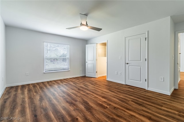 unfurnished bedroom with dark wood-type flooring and ceiling fan