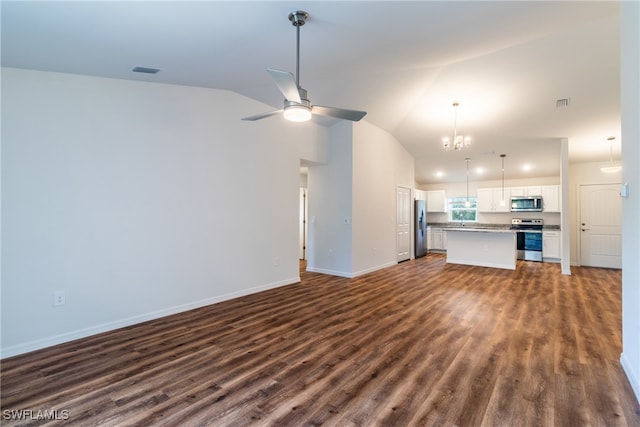 unfurnished living room featuring ceiling fan with notable chandelier, dark wood-type flooring, and lofted ceiling