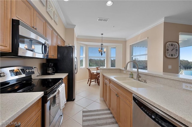 kitchen with sink, decorative light fixtures, ornamental molding, and appliances with stainless steel finishes