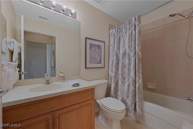 full bathroom with vanity, tile patterned flooring, toilet, and shower / bath combo with shower curtain