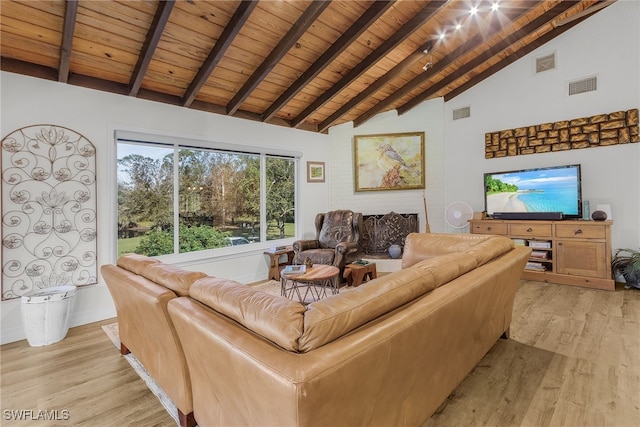 living room featuring beamed ceiling, light hardwood / wood-style floors, high vaulted ceiling, and wood ceiling