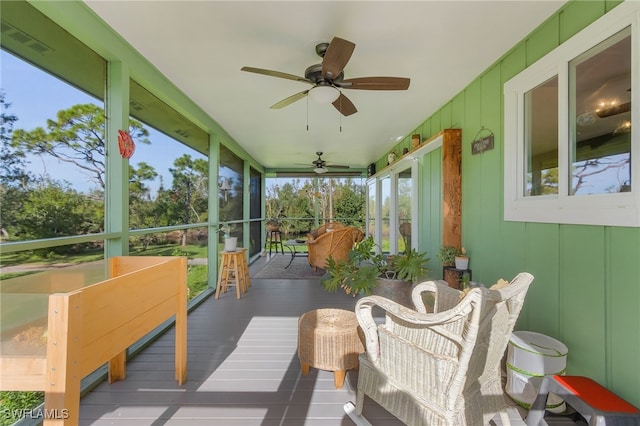 sunroom with ceiling fan and a healthy amount of sunlight