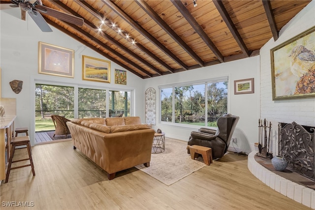 living room with light hardwood / wood-style flooring, high vaulted ceiling, wood ceiling, and beamed ceiling