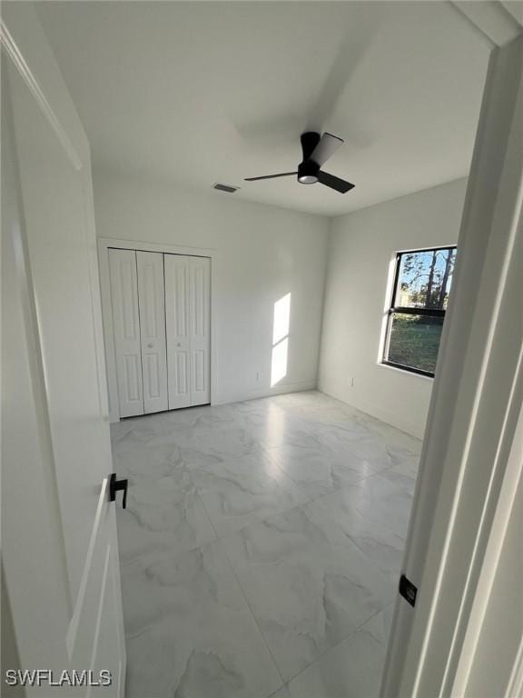 empty room with ceiling fan