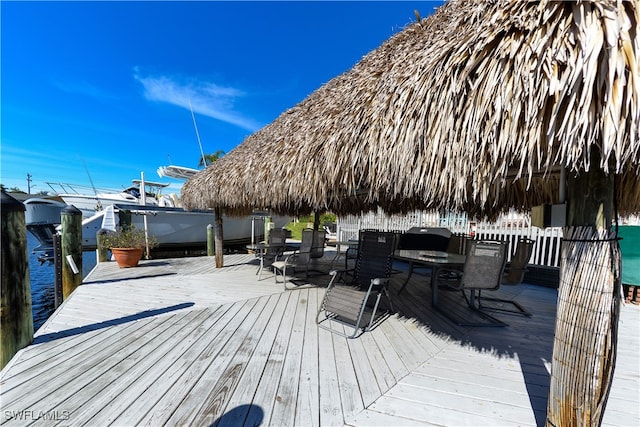 deck featuring a gazebo and a water view