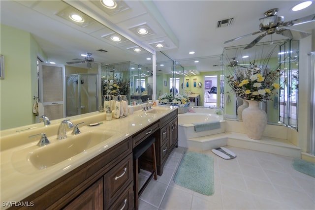 bathroom with tile patterned flooring, vanity, and independent shower and bath