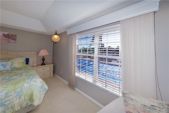 carpeted bedroom with a textured ceiling