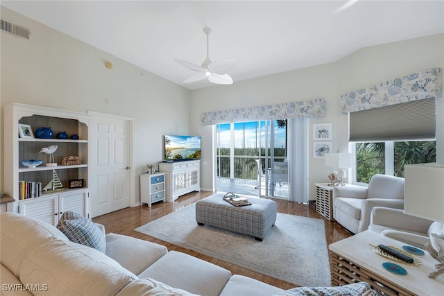 living room featuring hardwood / wood-style floors, ceiling fan, and plenty of natural light