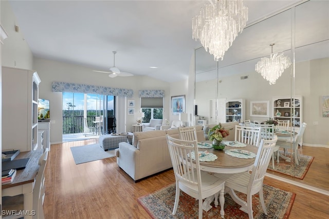 dining room featuring hardwood / wood-style flooring, ceiling fan, and lofted ceiling