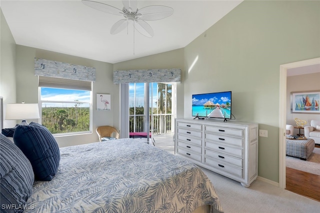 carpeted bedroom featuring access to exterior, ceiling fan, and lofted ceiling