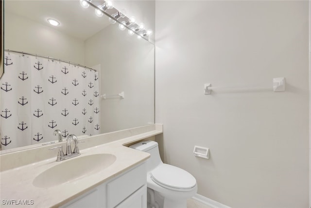 bathroom featuring vanity, toilet, and a shower with shower curtain