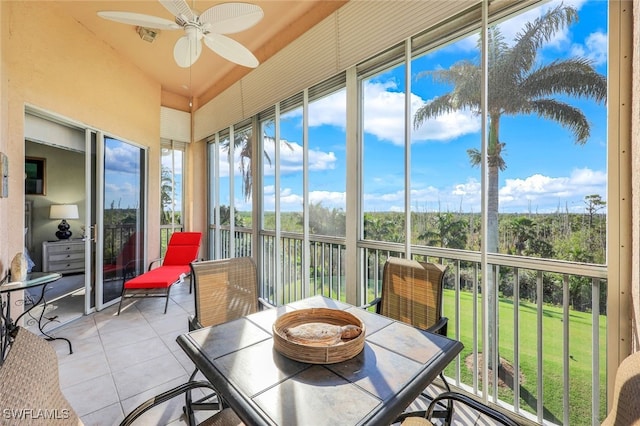 sunroom / solarium with plenty of natural light and ceiling fan