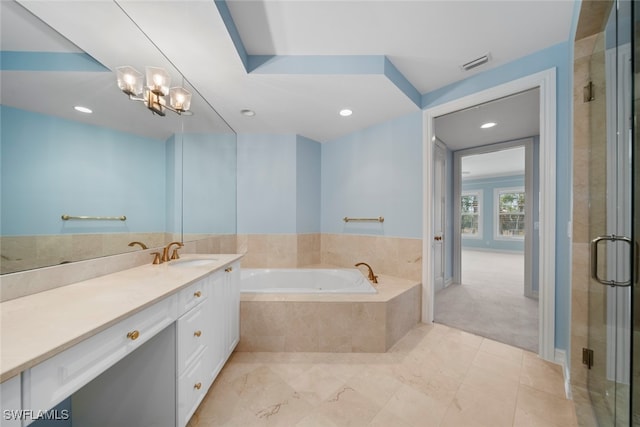 bathroom featuring vanity, separate shower and tub, and a chandelier