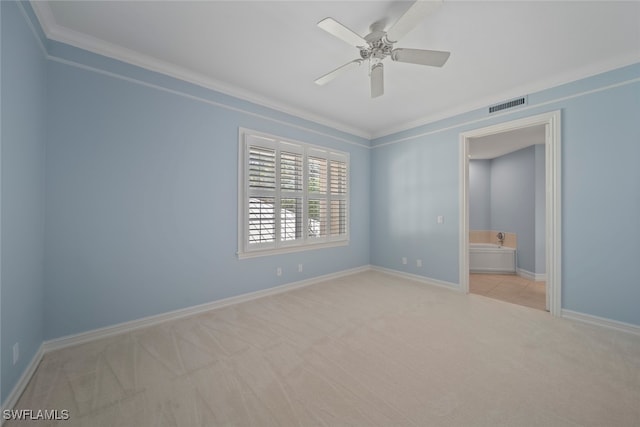 unfurnished room with ceiling fan, ornamental molding, and light carpet