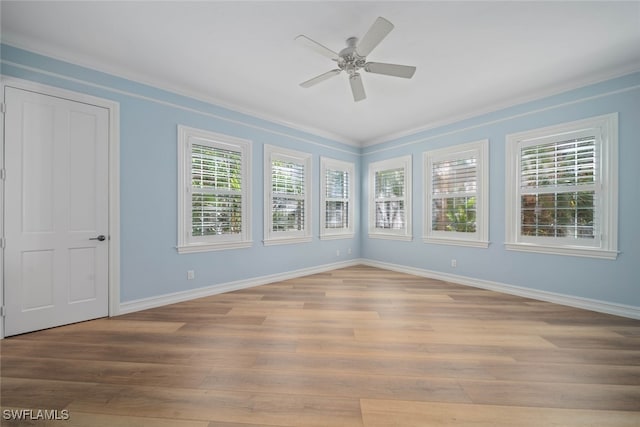 unfurnished room featuring light hardwood / wood-style flooring, ceiling fan, and ornamental molding