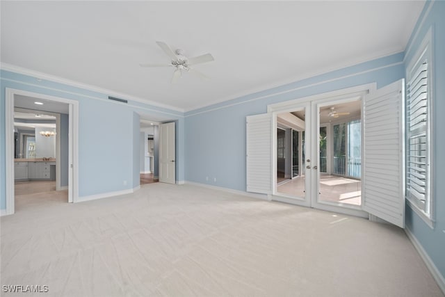 interior space featuring ceiling fan with notable chandelier, access to exterior, ornamental molding, and light carpet