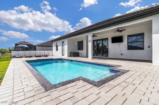 view of pool with ceiling fan and a patio