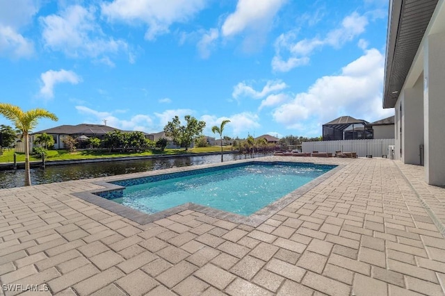 view of swimming pool featuring a patio area and a water view