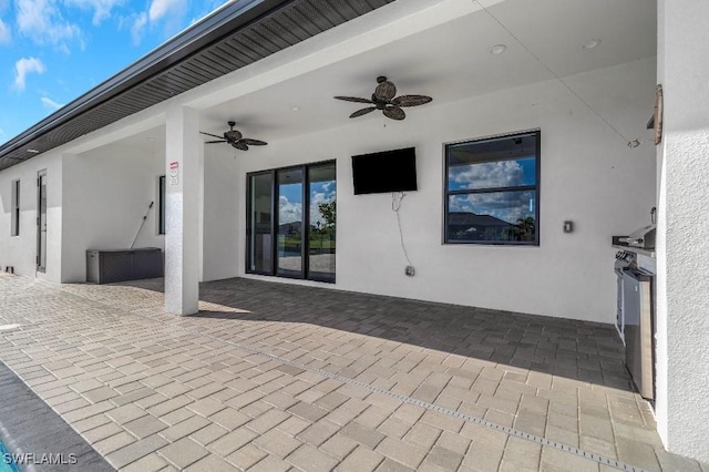 view of patio featuring ceiling fan