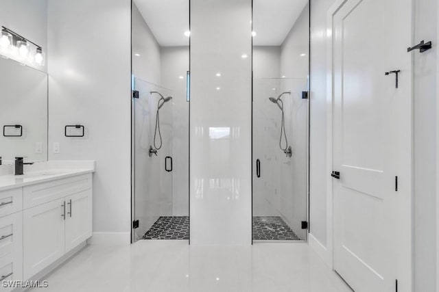 bathroom featuring tile patterned flooring, vanity, and a shower with door