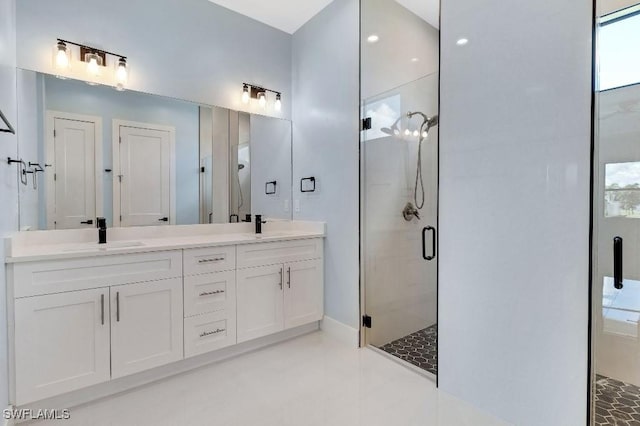 bathroom with vanity and walk in shower