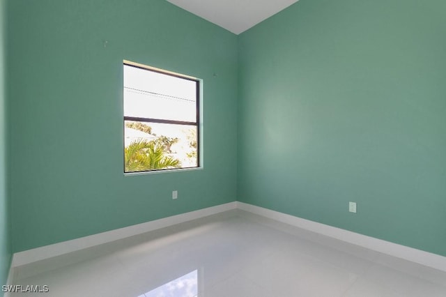 unfurnished room featuring tile patterned flooring